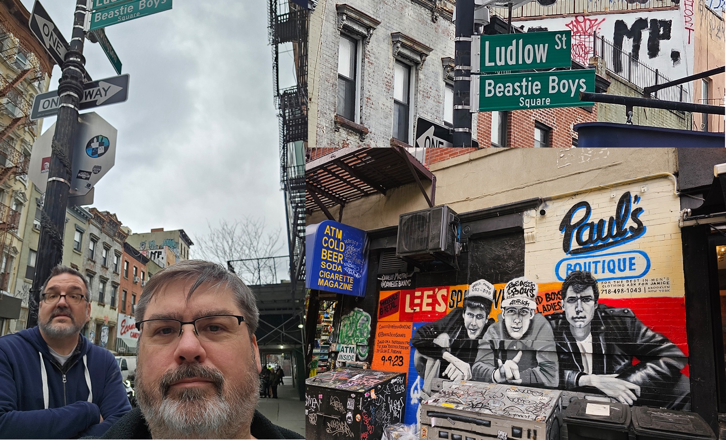 A person standing in front of a building with signs

Description automatically generated